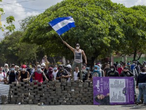 People demonstrate near a cobblestone barricade in Managua, Nicaragua, April 21. Pope Francis called for an end to violence in Nicaragua after several days of protests against proposed social security legislation led to the deaths of more than two dozen people. (CNS photo/Jorge Torres, EPA) See POPE-NICARAGUA-PROTESTS April 23, 2018.