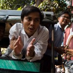 TOPSHOT - Detained Myanmar journalists Kyaw Soe Oo (C) and Wa Lone (R) talk to the media as is taken from a court in Yangon after making an appearance in his ongoing trial on February 14, 2018.
The court earlier denied bail to Wa Lone and Kyaw Soe Oo, two Reuters journalists charged under a secrecy act that could see them face up to 14 years in jail, in a case that has sparked outcry over shrinking media freedom. / AFP PHOTO / YE AUNG THU        (Photo credit should read YE AUNG THU/AFP/Getty Images)